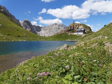 Wolayer Lake or Wolayersee with Wolayersee hut and war memorial