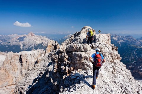 Mountain climbers decending along the Via Ferrata Marino Bianchi climbing route on Mount Cristallo