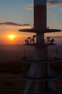 Transmission tower on the summit plateau of Mt Brocken at sunset
