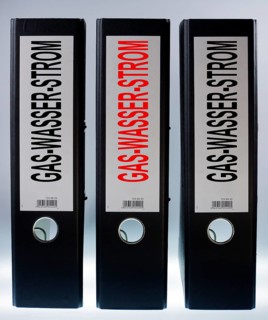 Three ring binders labeled Gas-Wasser-Strom