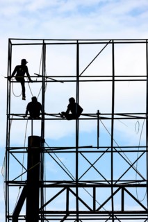 Unsecured workers assembling a scaffold