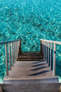 Steps leading into blue water