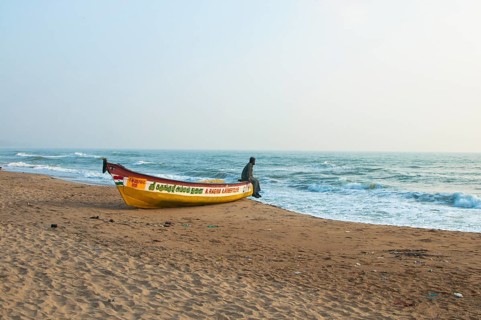 Man on a boat on a beach