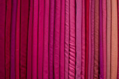 Fabrics lined up on a rack