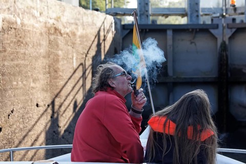 Father and daughter in the lock chamber while rising in a lock