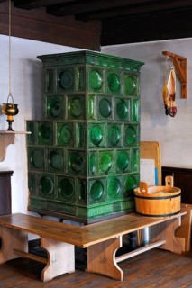 Historic tiled stove with oven bench