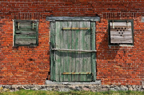 Door and window flaps of an old barn