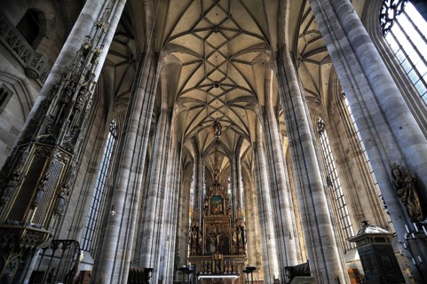 Vaulted ceiling and chancel of the late-gothic three-naved hall church