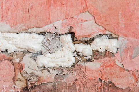 Wall cavity filled with foam insulation