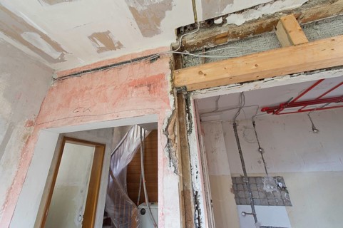 Opening in a wall with a new beam construction