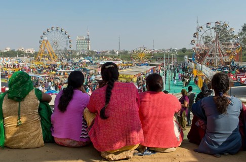 Indian women watching a fun fair