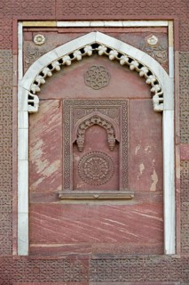 Decorative elements carved in sandstone and marble