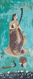 Woman wearing a gilded sari behind peacocks and a lotus pond
