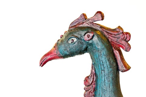 Head of a peacock made of wood