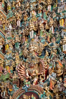 Colourful statues of gods and demons on the Gopuram or Gopura gate tower