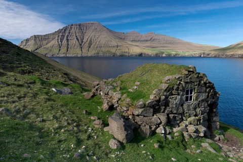 Old stone house on a fjord