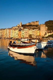 Fishing boats in the harbour in front of the historic town centre of Porto Venere
