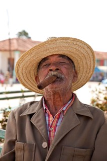 Elderly man smoking a cigar