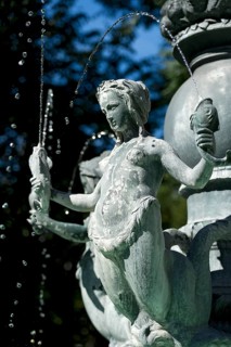 Mermaid holding fish in an Art Nouveau style fountain