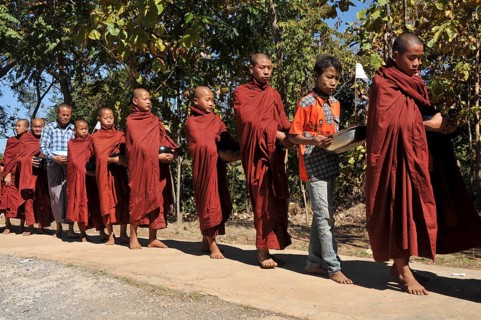 Buddhist monks collecting alms