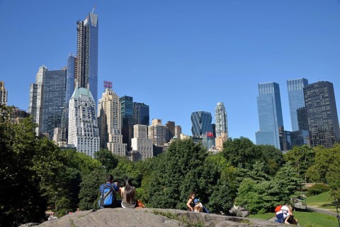 Park visitors with apartment buildings on Central Park South