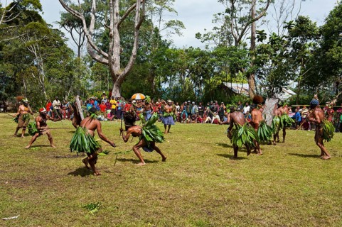 Members of a tribe in colourful decorations and face paint are celebrating at the traditional Sing Sing gathering in the highlands