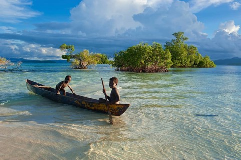 Boys in a canoe in the Marovo Lagoon