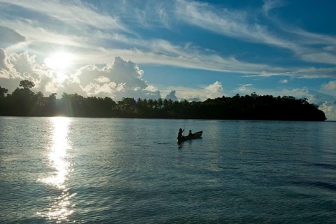 Boys in a canoe in the Marovo Lagoon