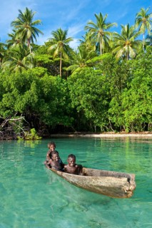 Local boys in a canoe in the Marovo Lagoon
