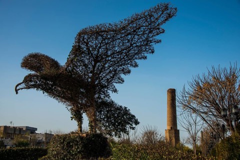 Eagle sculpture in front of Sheik Chooli minaret in Shanadar Park