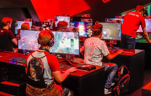 Young visitors at the pagan-online computer game in front of screens