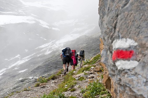 Red and white markings on rocks