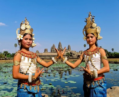 Temple dancers or apsaras at the Lotus Pond in front of the temple of Angkor Wat