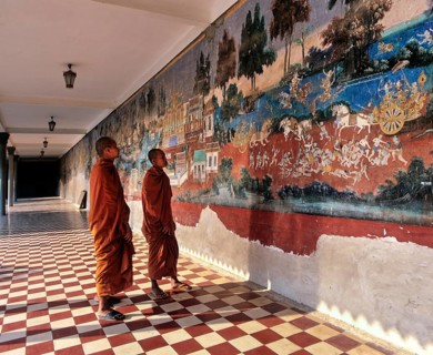 Monks standing in front of a wall painting from the Ramayana epic in the Silver Pagoda or Preah Vihear Preah Keo Morakot