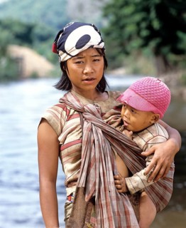 Young Karen woman breast-feeding her child