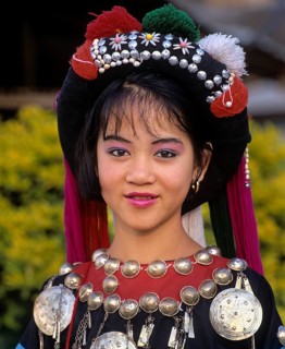 Lisu girl wearing a colourful headdress and the traditional costume of the mountain people