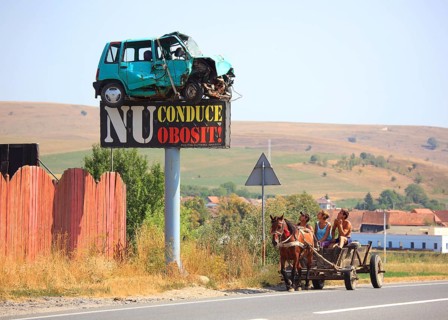 Horse-drawn carriage in traffic