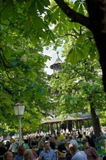 Beer garden at the Chinese Tower with blossoming chestnut trees