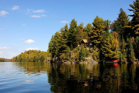 House on a rock surrounded by woods