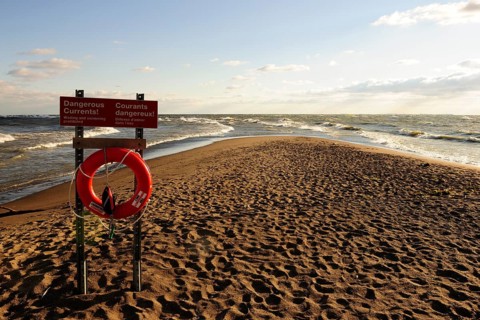 Lifebuoy and warning sign on Canada's southernmost point on Lake Erie