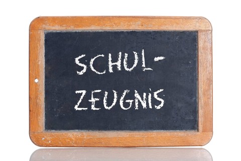 Old slate blackboard with the word "SCHUL-ZEUGNIS"