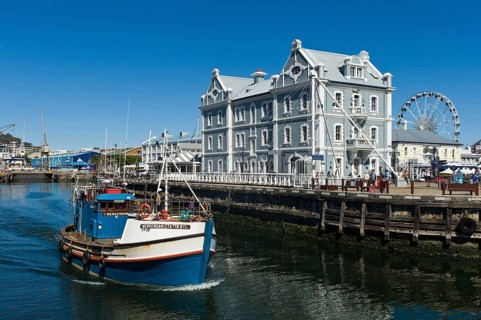 Fishing cutter in front of the African Trading Port building