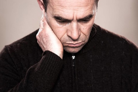 Man with markings for plastic surgery under his eye