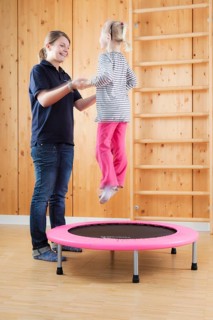 Girl during jump training on a trampoline