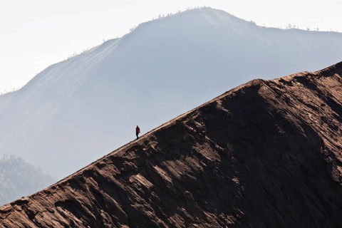 Hiker on Mount Bromo volcano