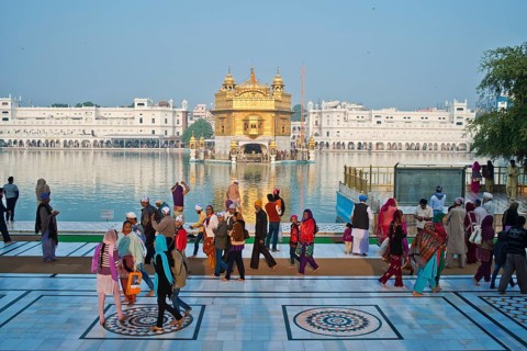 Sikh pilgrims walking around the Amrit Sagar or Holy Lake