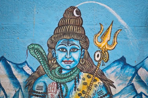 The Hindu god Shiva painted on the wall of a house on the banks of the Ganges River
