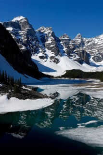 Wenkchemna Peaks mountain group reflected in the glacial Moraine Lake