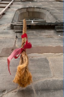 A long braid hanging from the tower window