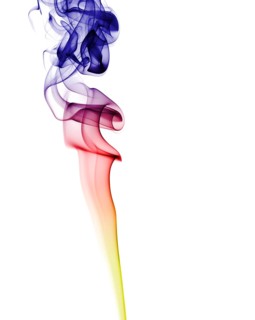 Colourful smoke from an incense stick or joss stick
